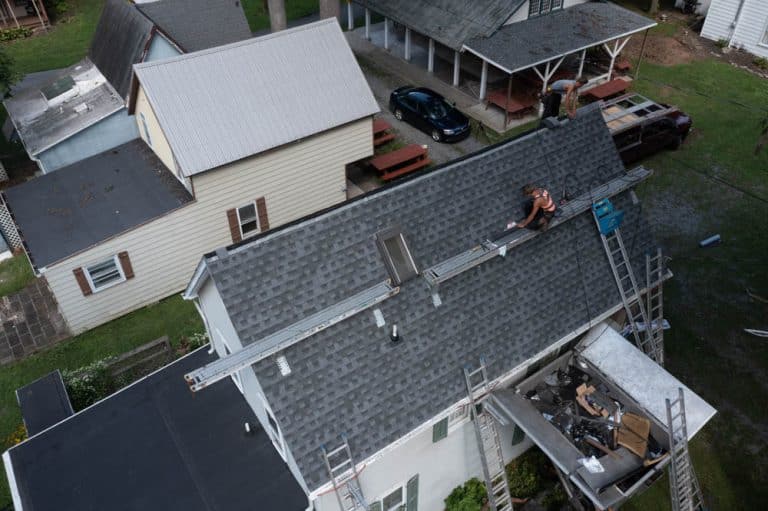 man working on a roof